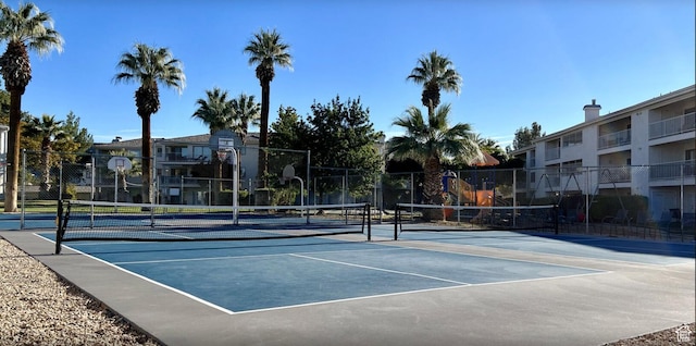 view of sport court with community basketball court and fence