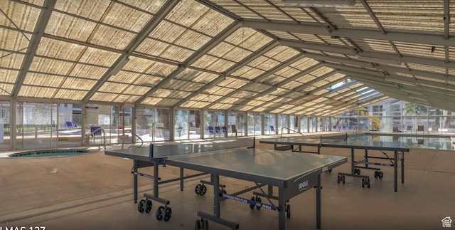 game room with lofted ceiling