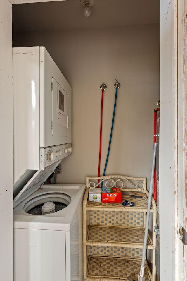 washroom with laundry area and stacked washer / dryer