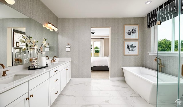623 S 230 W Unit 3, Ivins, UT 84738 - ensuite bathroom featuring wallpapered walls, a freestanding bath, marble finish floor, and a sink