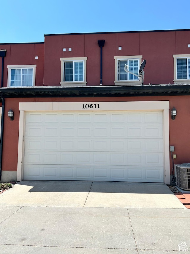 10611 S Oquirrh Lake Rd W, South Jordan, UT 84009 - garage with cooling unit and concrete driveway