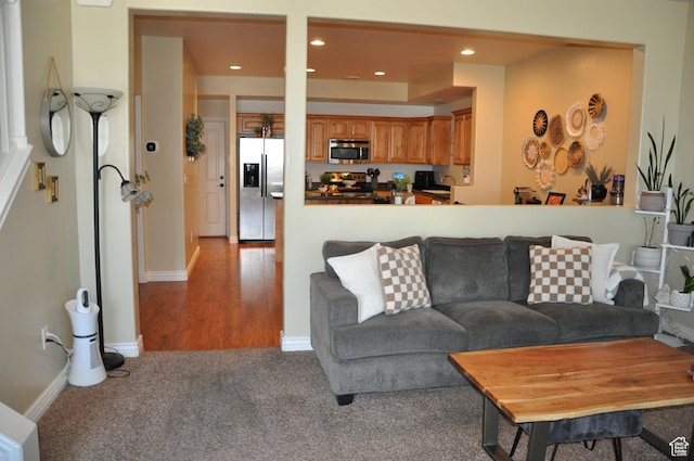 10611 S Oquirrh Lake Rd W, South Jordan, UT 84009 - living room with recessed lighting, baseboards, and light colored carpet