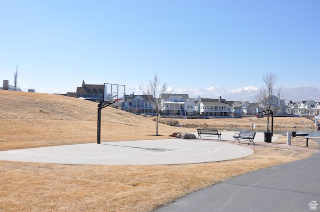 10611 S Oquirrh Lake Rd W, South Jordan, UT 84009 - view of sport court featuring a mountain view, community basketball court, and a residential view