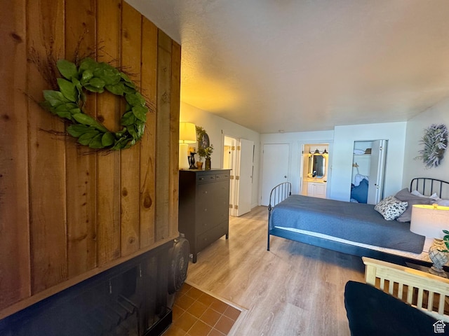 2176 S Bear Blvd Unit 316, & Garden City, UT 84028 - bedroom with wood finished floors and ensuite bathroom
