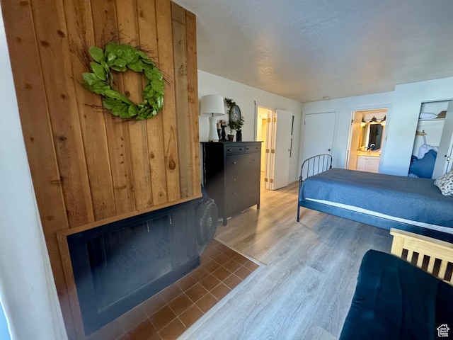 2176 S Bear Blvd Unit 316, & Garden City, UT 84028 - bedroom featuring wood finished floors and connected bathroom