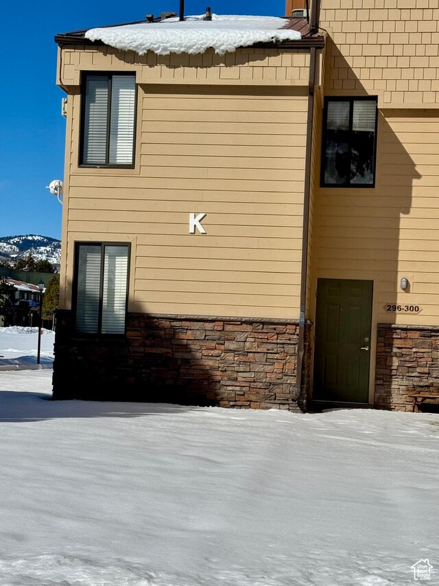 2176 S Bear Blvd Unit 316, & Garden City, UT 84028 - view of snowy exterior featuring stone siding