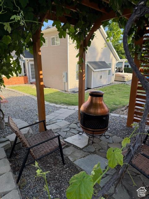 10063 N Poplar Ct, Cedar Hills, UT 84062 - view of patio / terrace with an outdoor fire pit
