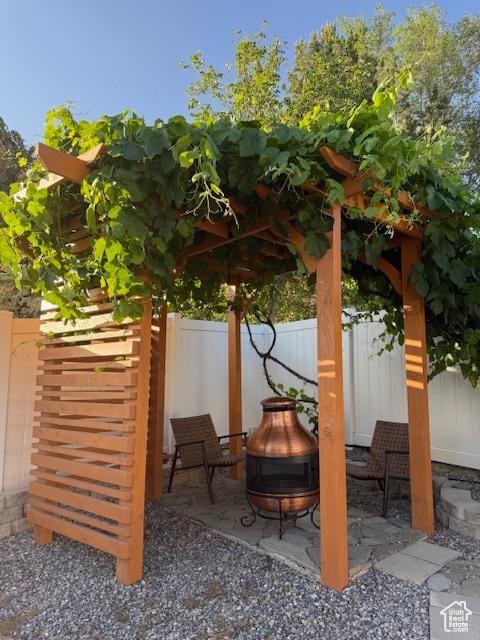 10063 N Poplar Ct, Cedar Hills, UT 84062 - view of patio / terrace with an outdoor fire pit