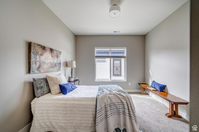 bedroom with visible vents, baseboards, and carpet flooring
