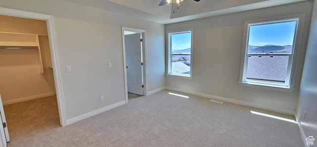 3392 E Stillwater, Eagle Mountain, UT 84005 - unfurnished bedroom featuring light carpet, visible vents, baseboards, a spacious closet, and a closet