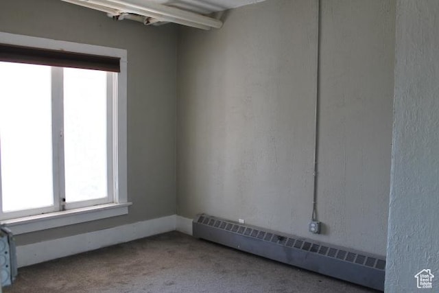 653 E 300 S, Salt Lake City, UT 84102 - spare room with carpet and a baseboard radiator