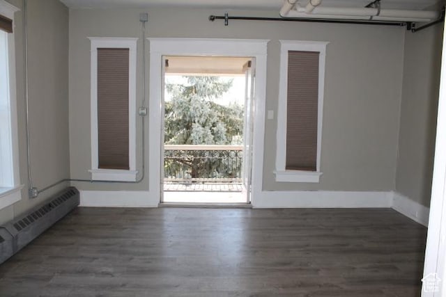 653 E 300 S, Salt Lake City, UT 84102 - interior space with a baseboard radiator, baseboards, and wood finished floors