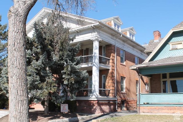 653 E 300 S, Salt Lake City, UT 84102 - view of side of home with a balcony and covered porch