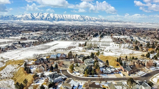 243 Eastridge E, Logan, UT 84321 - snowy aerial view featuring a residential view and a mountain view