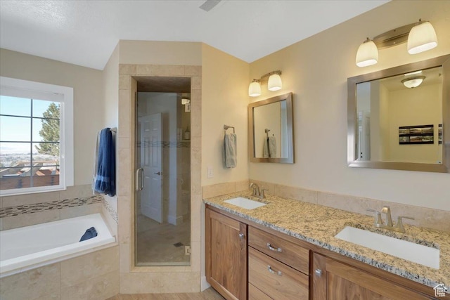 243 Eastridge E, Logan, UT 84321 - bathroom with double vanity, a stall shower, a sink, and a bath