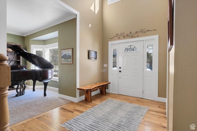 243 Eastridge E, Logan, UT 84321 - entrance foyer featuring crown molding, baseboards, and wood finished floors