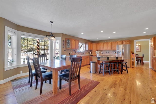 243 Eastridge E, Logan, UT 84321 - dining room with light wood-type flooring, baseboards, and recessed lighting