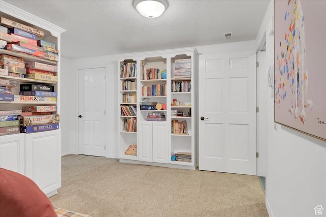 243 Eastridge E, Logan, UT 84321 - living area with light carpet, a textured ceiling, and visible vents