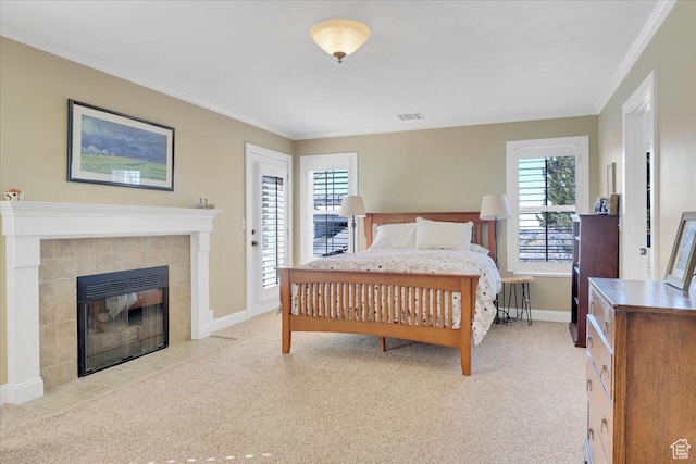 243 Eastridge E, Logan, UT 84321 - bedroom with light carpet, visible vents, and a tile fireplace
