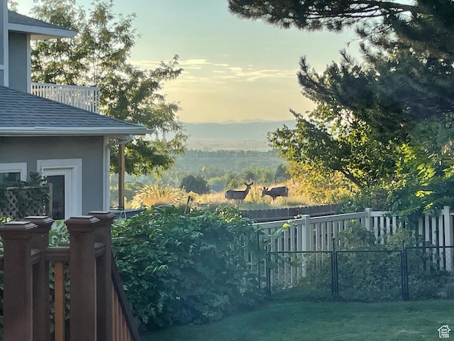 243 Eastridge E, Logan, UT 84321 - yard at dusk with fence