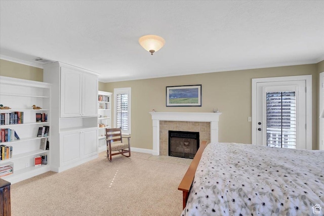 243 Eastridge E, Logan, UT 84321 - bedroom with a fireplace, light colored carpet, visible vents, a textured ceiling, and baseboards