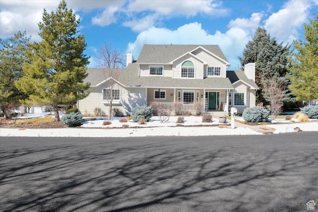 243 Eastridge E, Logan, UT 84321 - view of front facade with covered porch and a chimney