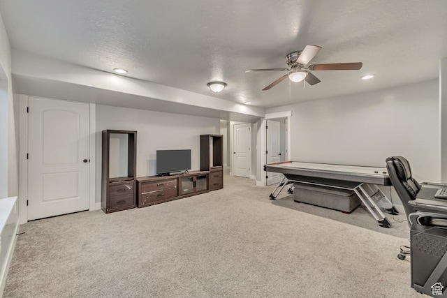exercise area with baseboards, a ceiling fan, carpet, a textured ceiling, and recessed lighting