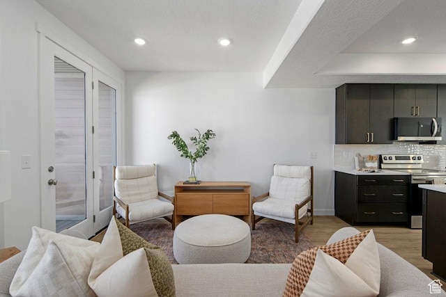 277 W 430 N Unit 1-03, Salt Lake City, UT 84103 - living room with light wood-type flooring, recessed lighting, and baseboards
