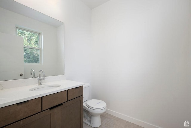277 W 430 N Unit 1-03, Salt Lake City, UT 84103 - bathroom featuring toilet, vanity, and baseboards