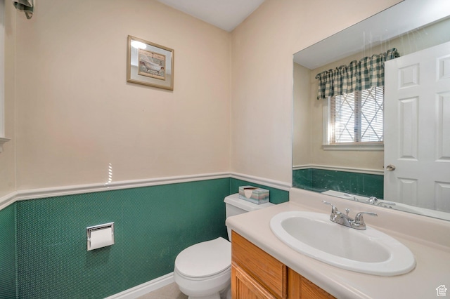 half bathroom with toilet and vanity