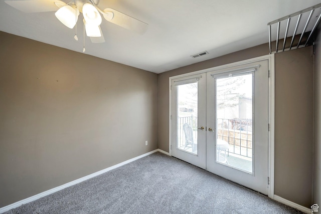 doorway with visible vents, a wealth of natural light, french doors, and carpet flooring