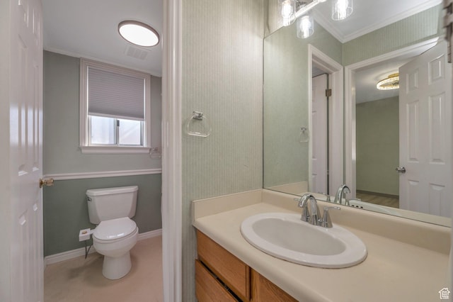 bathroom with crown molding, visible vents, baseboards, toilet, and vanity