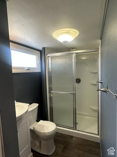 143 N 150 W, Tooele, UT 84074 - full bath featuring toilet, wood finished floors, vanity, and a shower stall