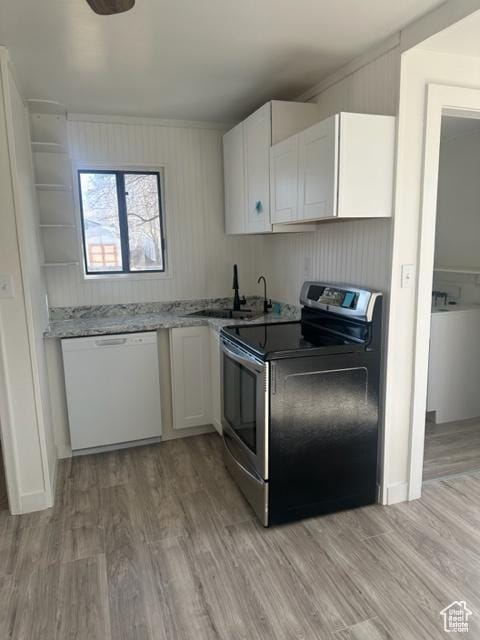 143 N 150 W, Tooele, UT 84074 - kitchen with white dishwasher, a sink, white cabinets, and stainless steel electric stove