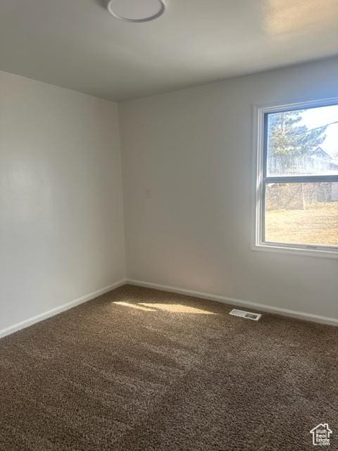 143 N 150 W, Tooele, UT 84074 - spare room featuring carpet floors, visible vents, and baseboards