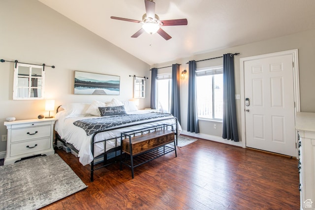 bedroom with vaulted ceiling, ceiling fan, wood finished floors, and baseboards
