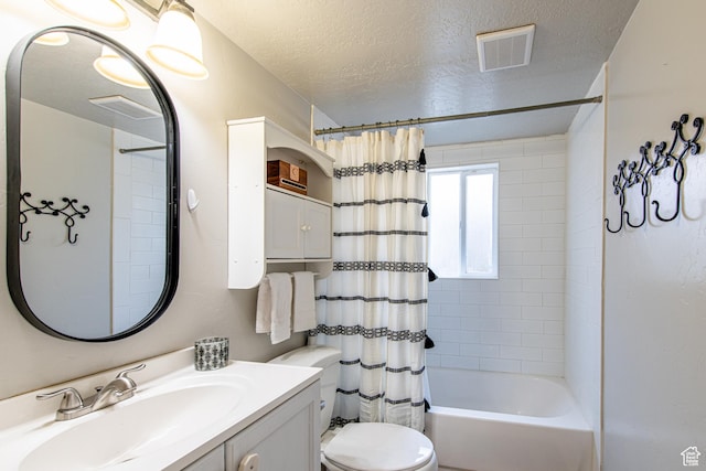 bathroom with visible vents, toilet, shower / bath combo with shower curtain, a textured ceiling, and vanity