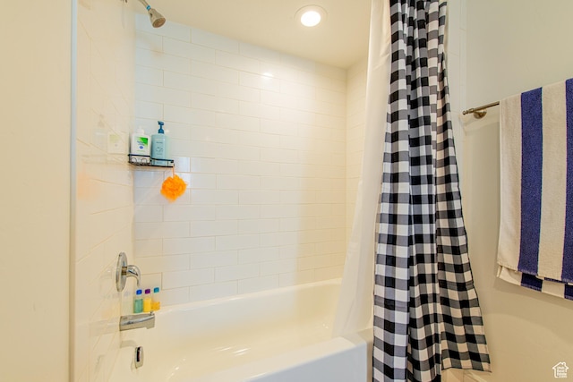 full bath with shower / bath combo with shower curtain and recessed lighting