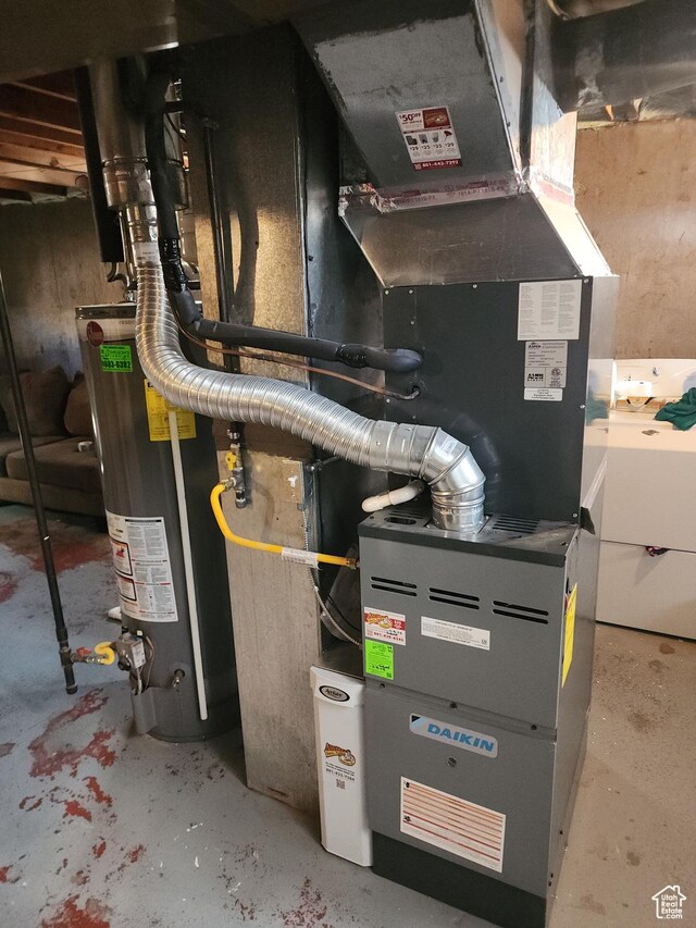 1105 9th St, Ogden, UT 84404 - utility room with gas water heater and heating unit