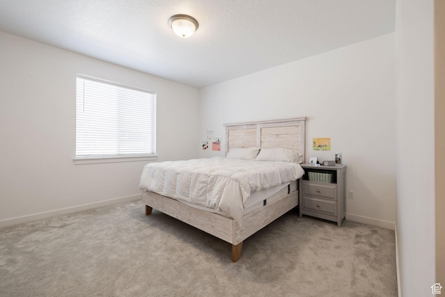 carpeted bedroom with baseboards