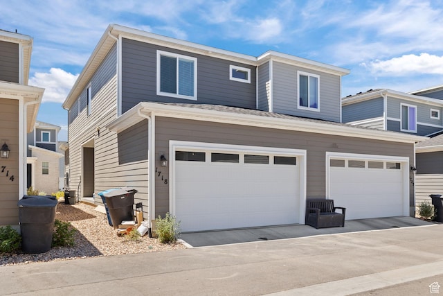 view of front of house featuring an attached garage and concrete driveway