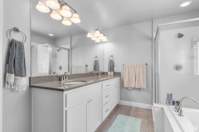 4927 W Yellow Topaz Dr, Herriman, UT 84096 - bathroom with double vanity, a stall shower, tile patterned flooring, a bathtub, and a sink