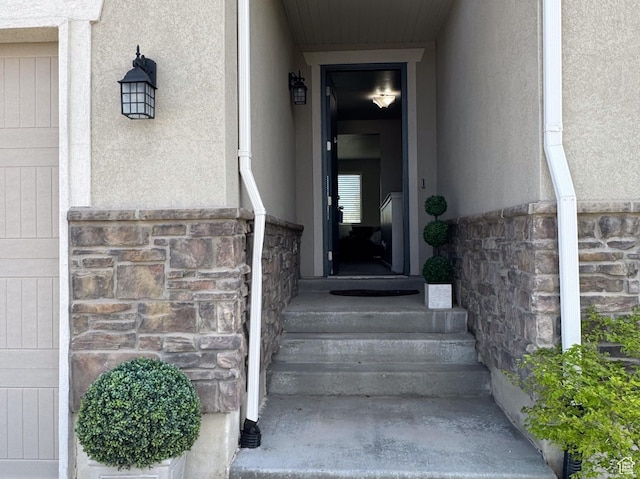 6583 W Annie Lee Way, West Jordan, UT 84081 - doorway to property with stone siding and stucco siding