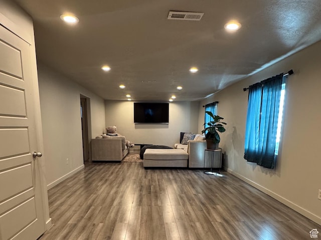 6583 W Annie Lee Way, West Jordan, UT 84081 - living area with wood finished floors, recessed lighting, visible vents, and baseboards