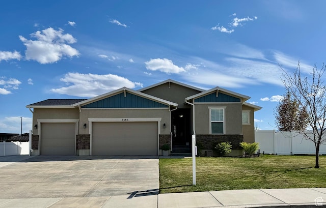 6583 W Annie Lee Way, West Jordan, UT 84081 - craftsman-style house featuring fence, driveway, a front yard, and an attached garage
