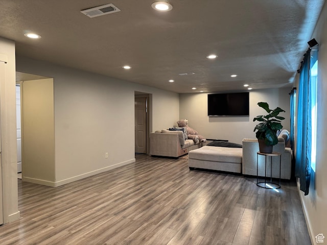 6583 W Annie Lee Way, West Jordan, UT 84081 - living room featuring recessed lighting, visible vents, and wood finished floors