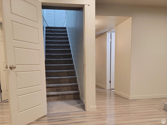 6583 W Annie Lee Way, West Jordan, UT 84081 - stairway featuring wood finished floors and baseboards