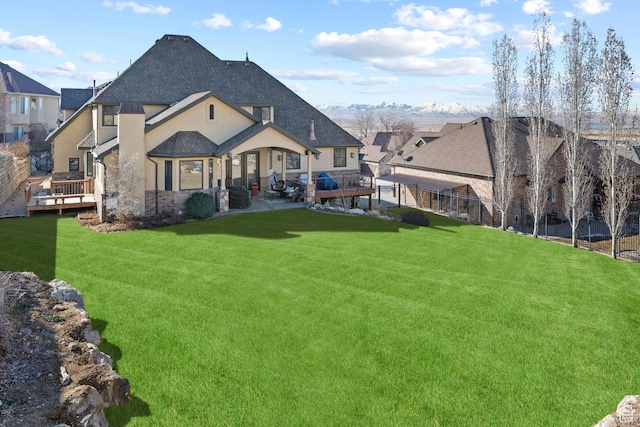 267 E Lucky Star Way, Farmington, UT 84025 - rear view of house featuring a shingled roof, stucco siding, a deck, and stone siding