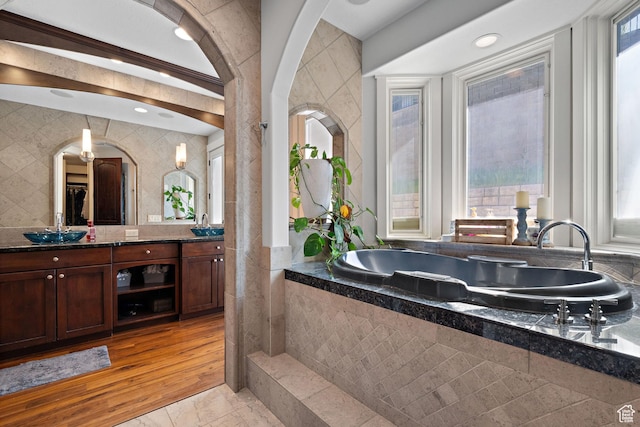 267 E Lucky Star Way, Farmington, UT 84025 - bathroom featuring tile walls, tiled tub, and double vanity