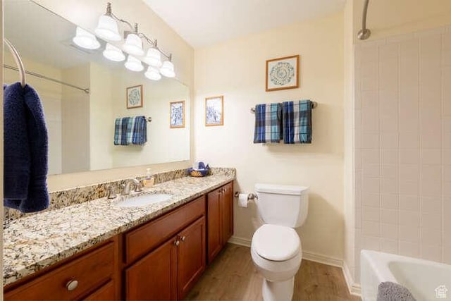 560 E S Temple N Pl 102, Salt Lake City, UT 84102 - bathroom featuring wood finished floors, toilet, vanity, baseboards, and shower / bathtub combination
